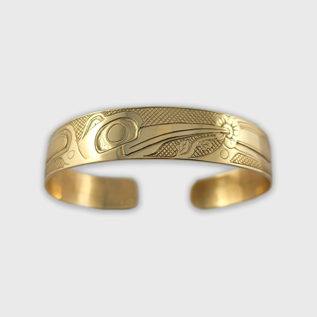Indigenous gold Hummingbird bracelet hand-carved by Haida artist Carmen Goertzen 