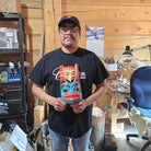 Eugene Alfred holding his Bear Mask