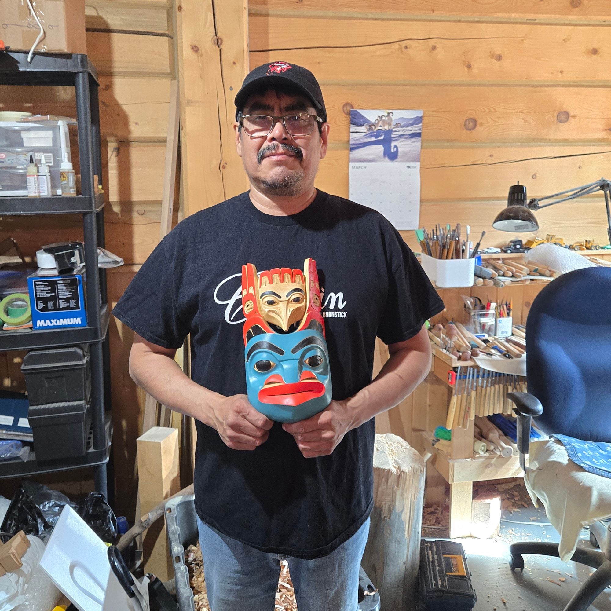 Eugene Alfred holding his Bear Mask