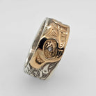 silver and gold wedding band with diamonds by Bill Helin