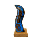 Wooden carvings with blue and brown design on a white background