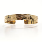 Gold Dolphins Bracelet by Tsimshian artist Bill Helin