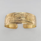 Gold Hummingbird, Eagle, and Orca Bracelet by Tsimshian artist Bill Helin