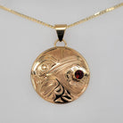 Gold Hummingbird Pendant by Kwakwaka'wakw artist Chris Cook