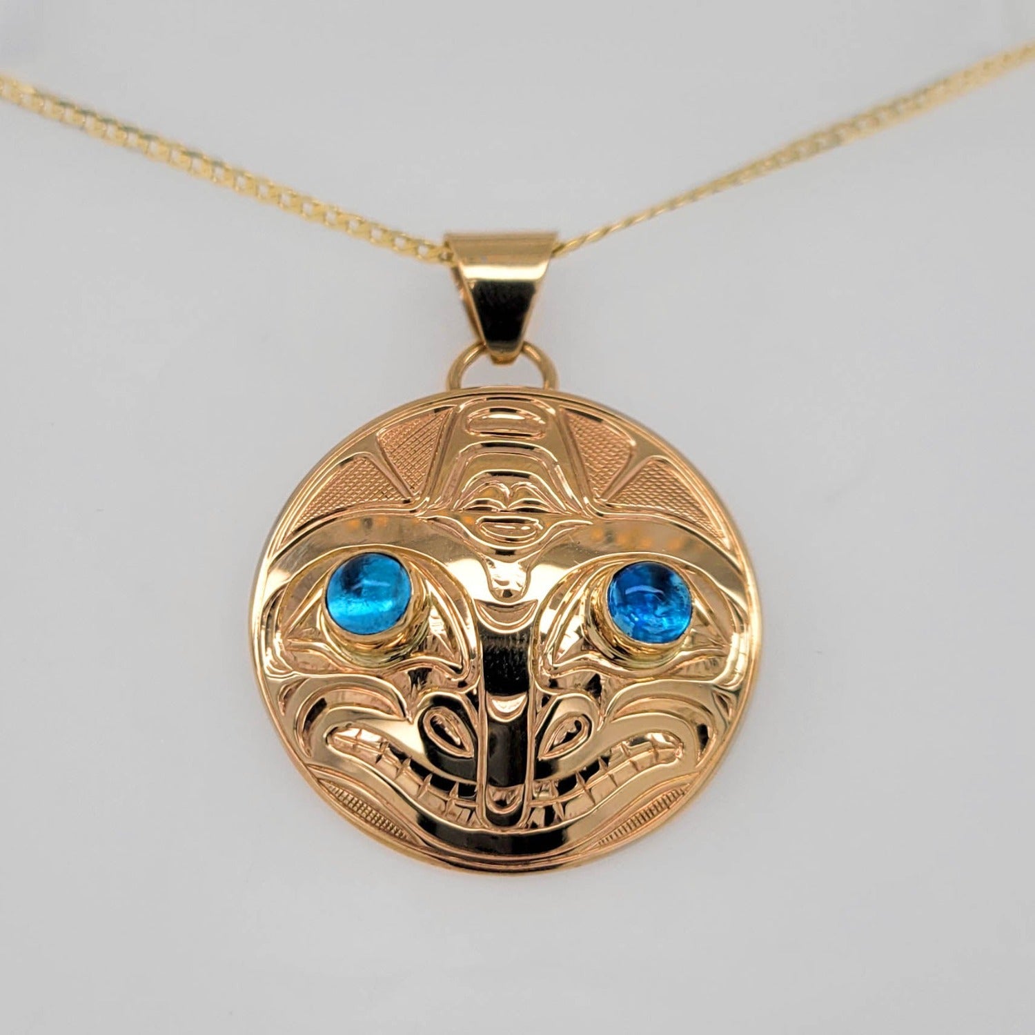 Gold Orca Pendant by Kwakwaka'wakw artist Chris Cook