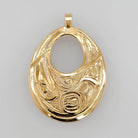 Gold Raven Pendant by Tsimshian artist Bill Helin