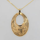 Gold Raven Pendant by Tsimshian artist Bill Helin