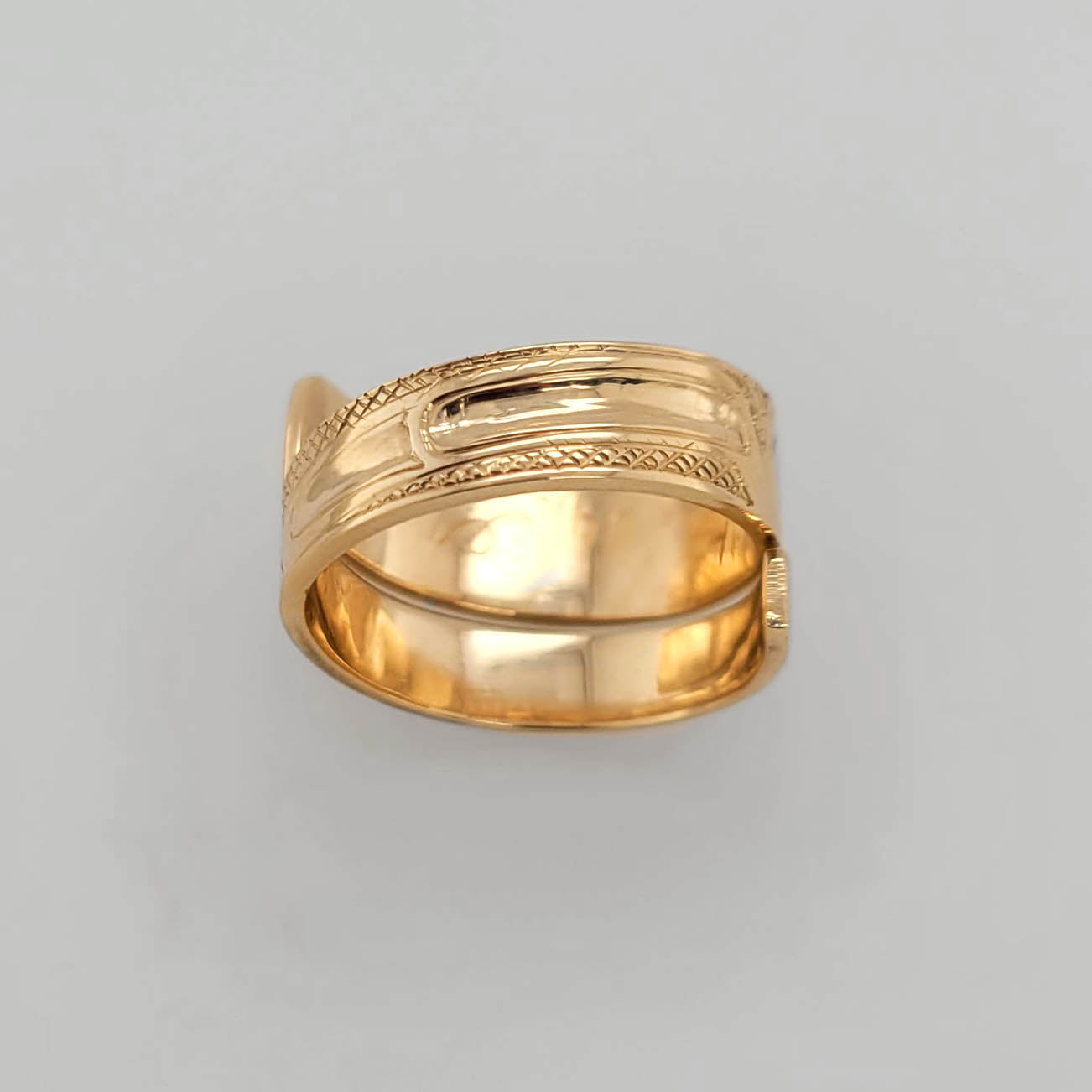 Gold Raven Wrap Ring by Haida artist Carmen Goertzen