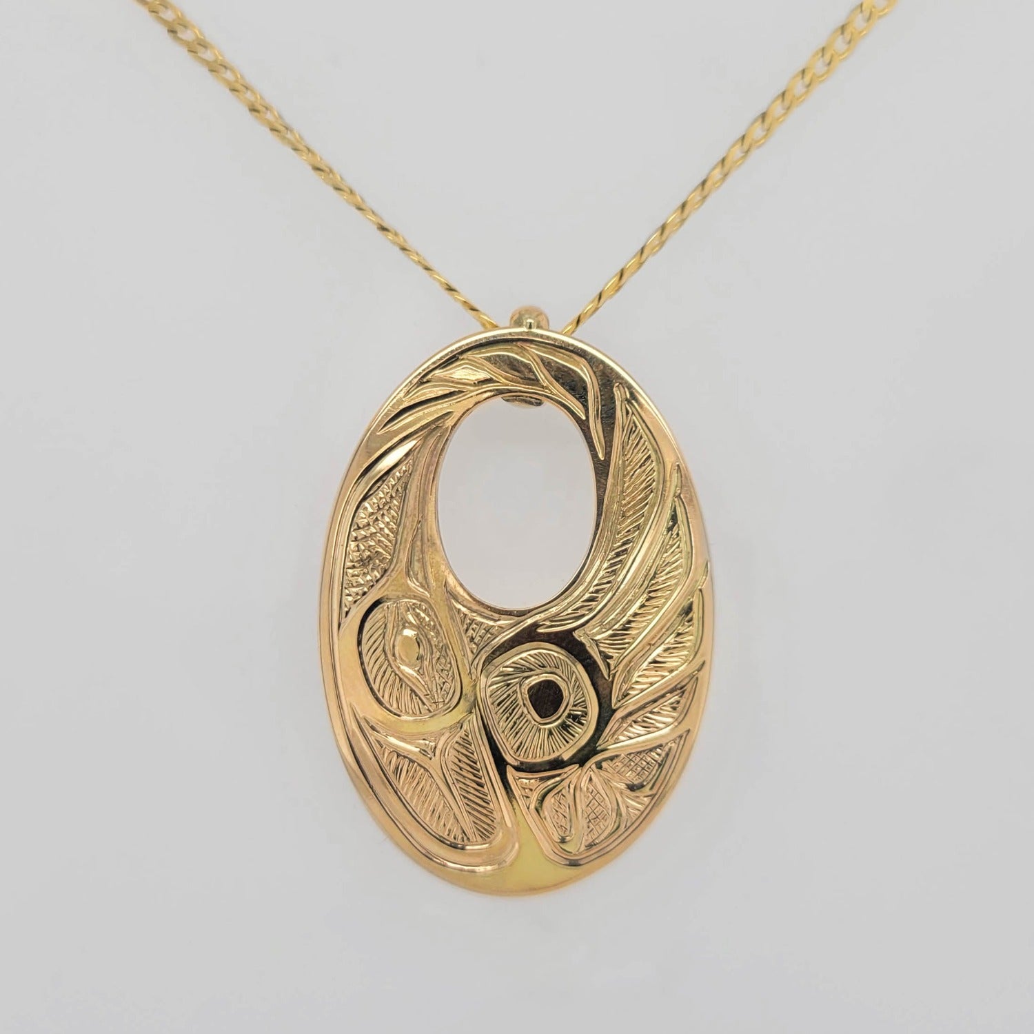 Gold Hummingbird Pendant by Tsimshian artist Bill Helin