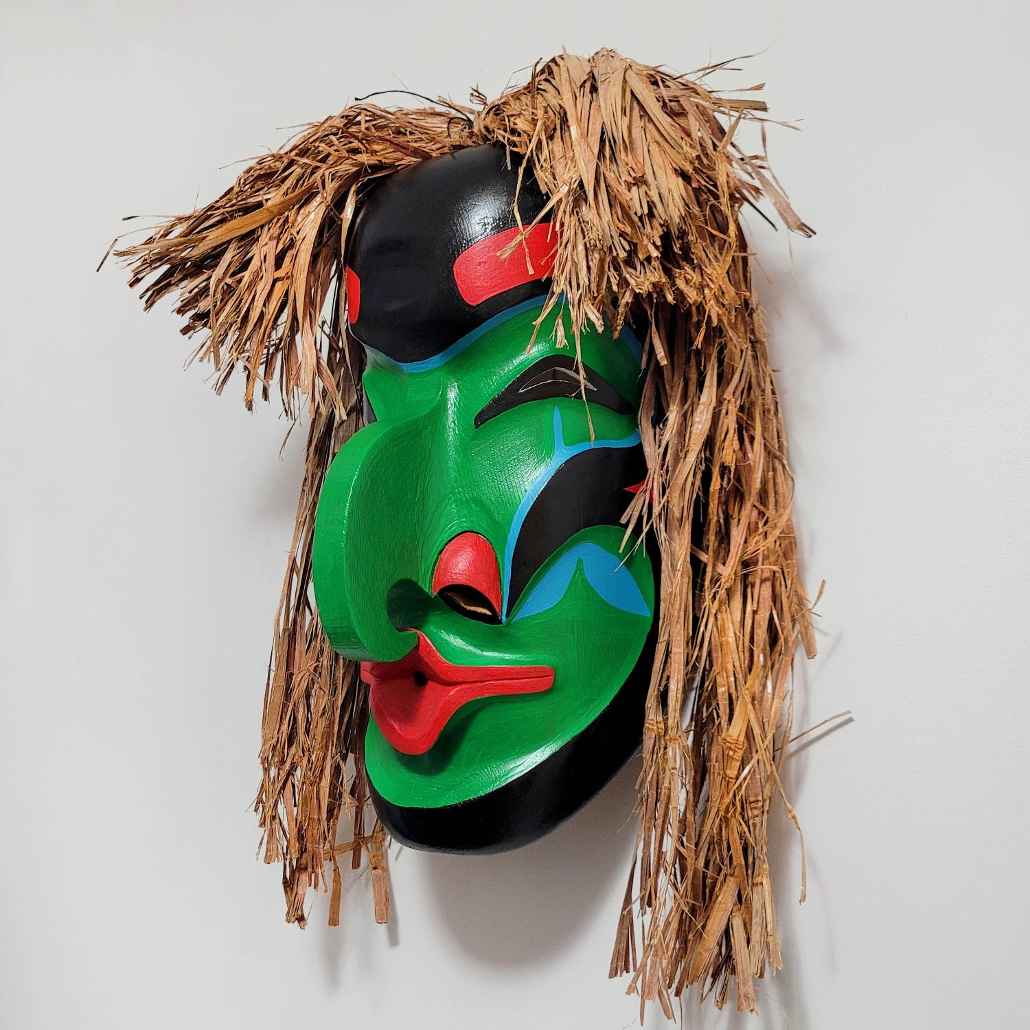 Pitch Woman Mask by Nuu-chah-nulth artist Russell Tate