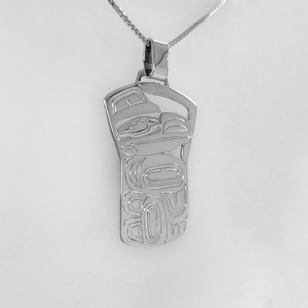 this is a Silver Haida Copper-shaped Raven Pendant