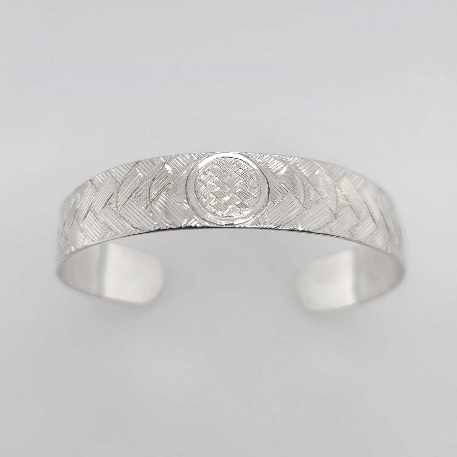 Silver Solar Eclipse Bracelet by Coast Salish artist Jody Sparrow