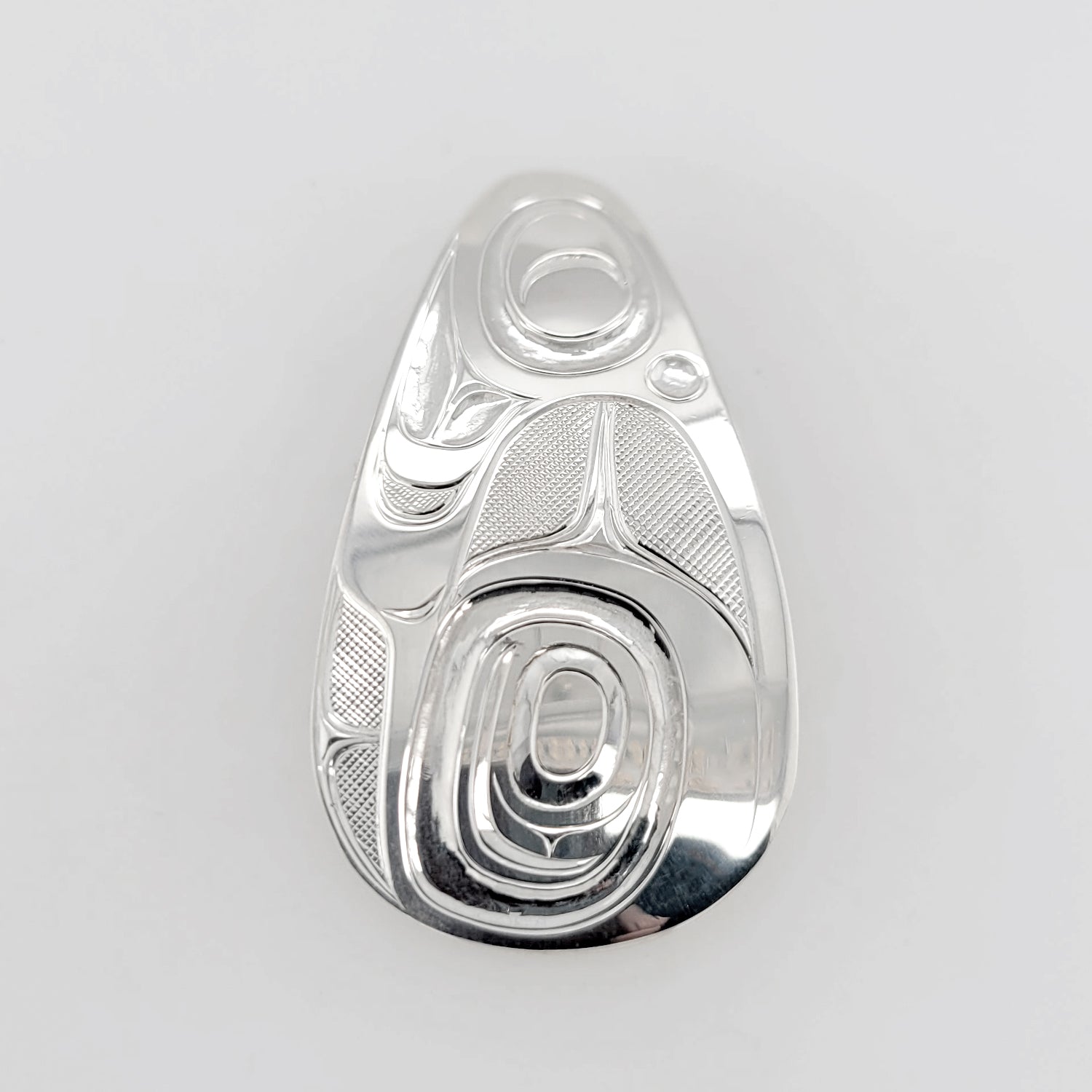 Silver Formline Pendant by Nuxalk artist Kelly Robinson