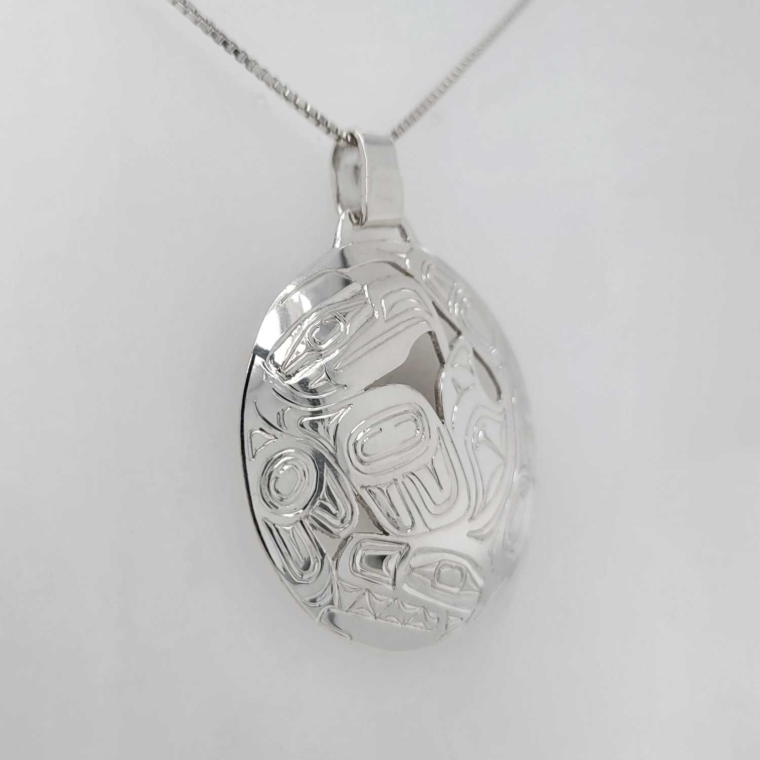 Silver Eagle and Orca Pendant by Haida artist Garner Moody