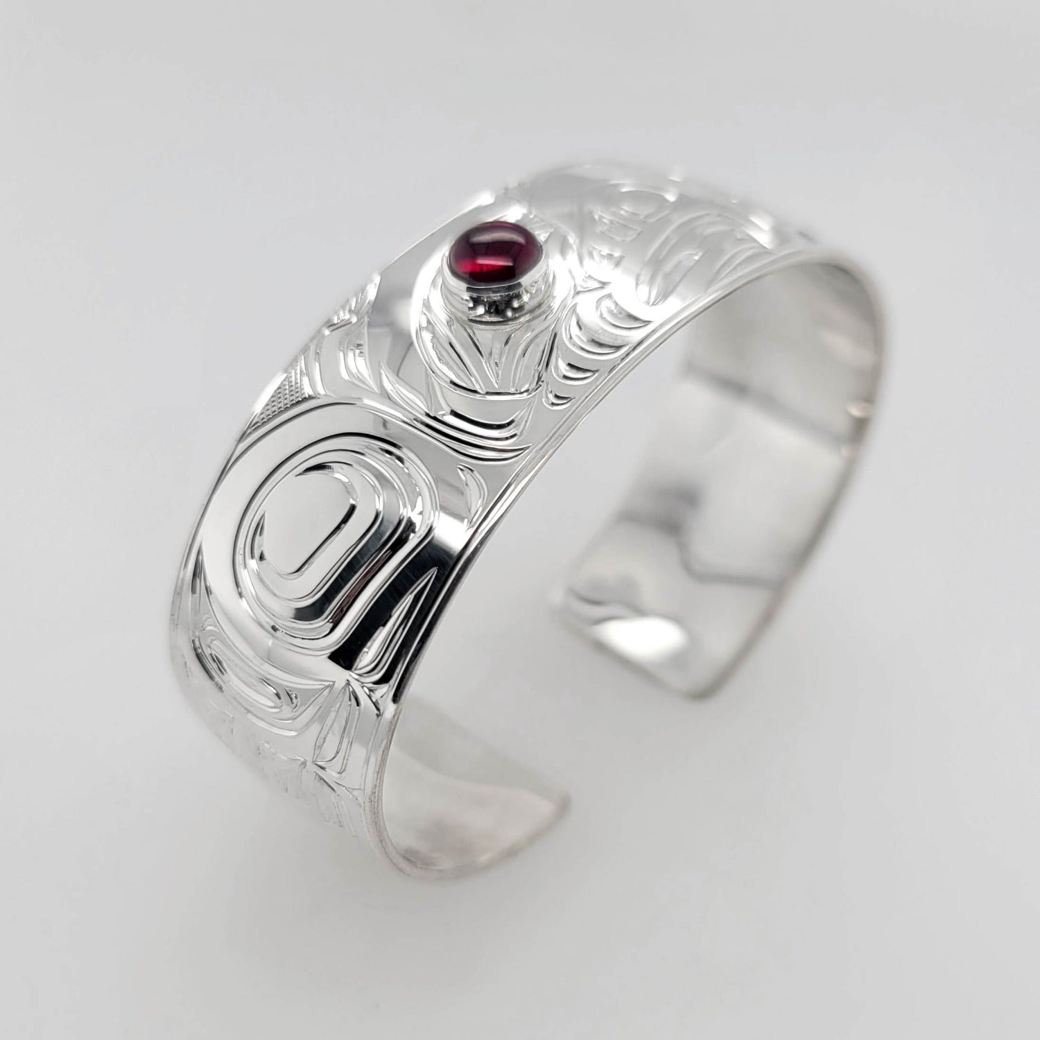 Silver and Garnet Eagle Bracelet by Kwakwaka'wakw artist Chris Cook