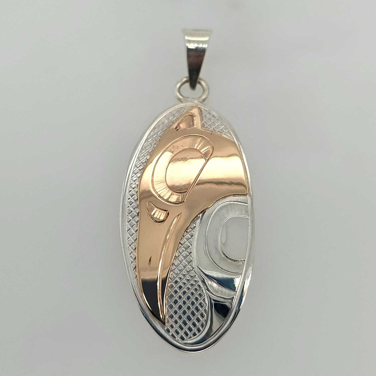 Silver and Gold Oval Raven Pendant by Cree artist Justin Rivard ...