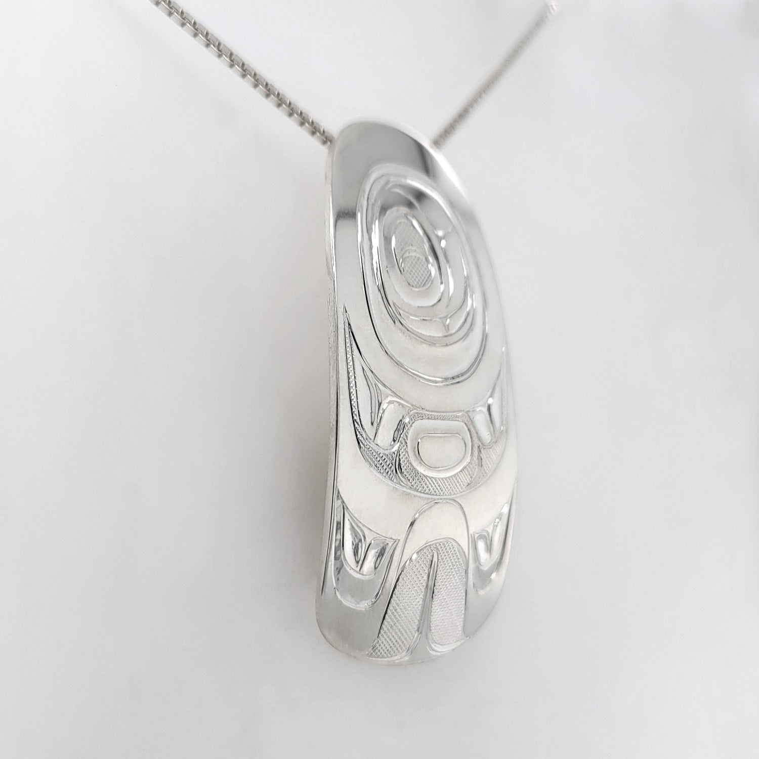 Silver Raven Tail Pendant by Nuxalk artist Kelly Robinson