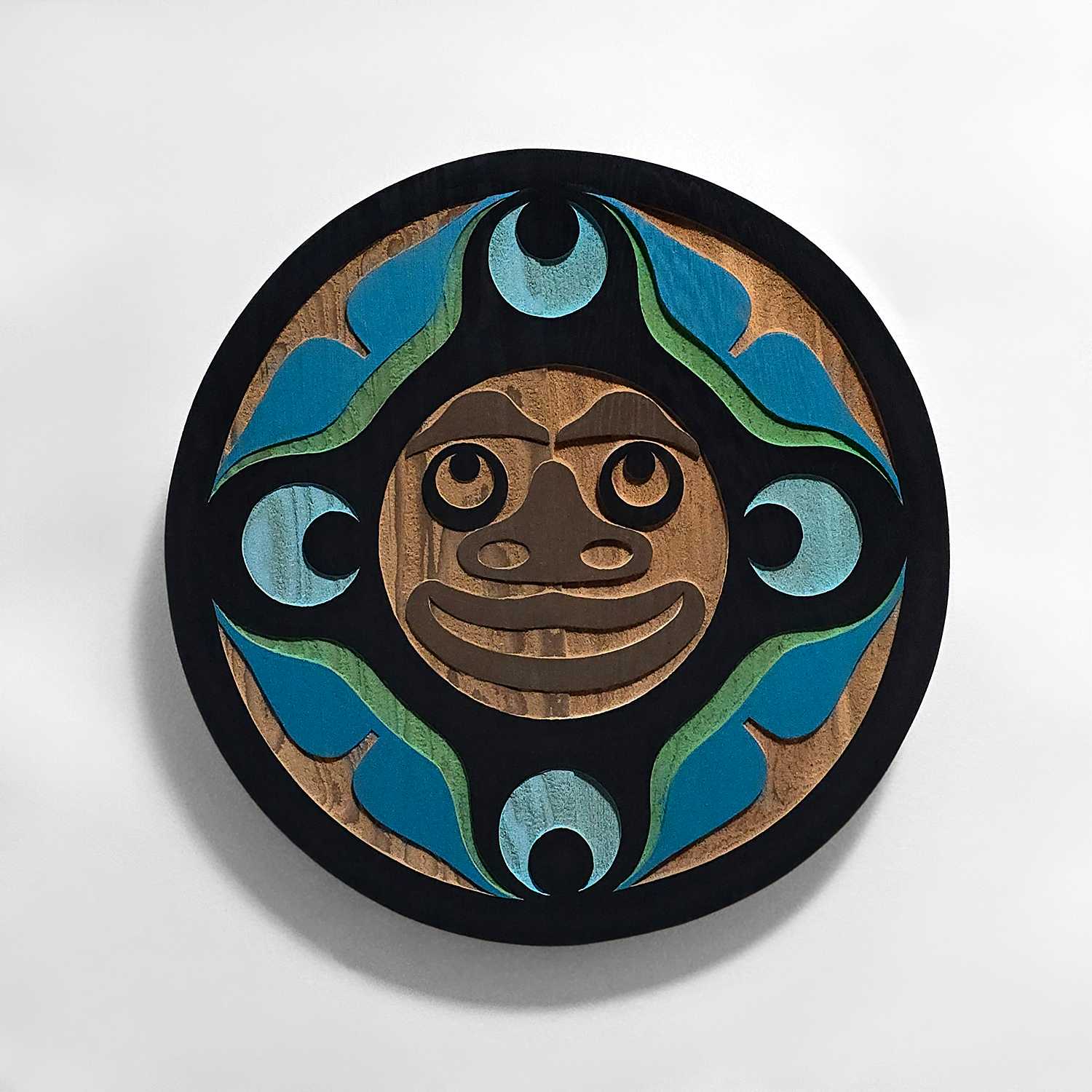 small sandblasted moon panel by Kwakwaka'wakw artist Trevor Hunt