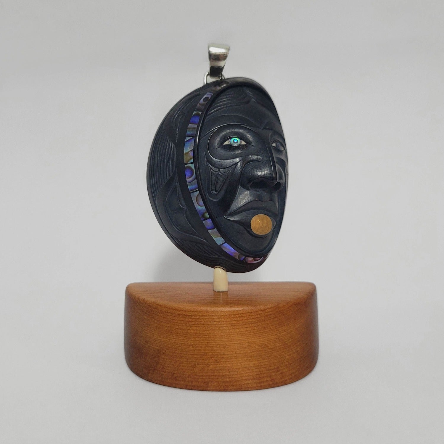 Woman in the Moon argillite pendant by Haida artist Darrell White