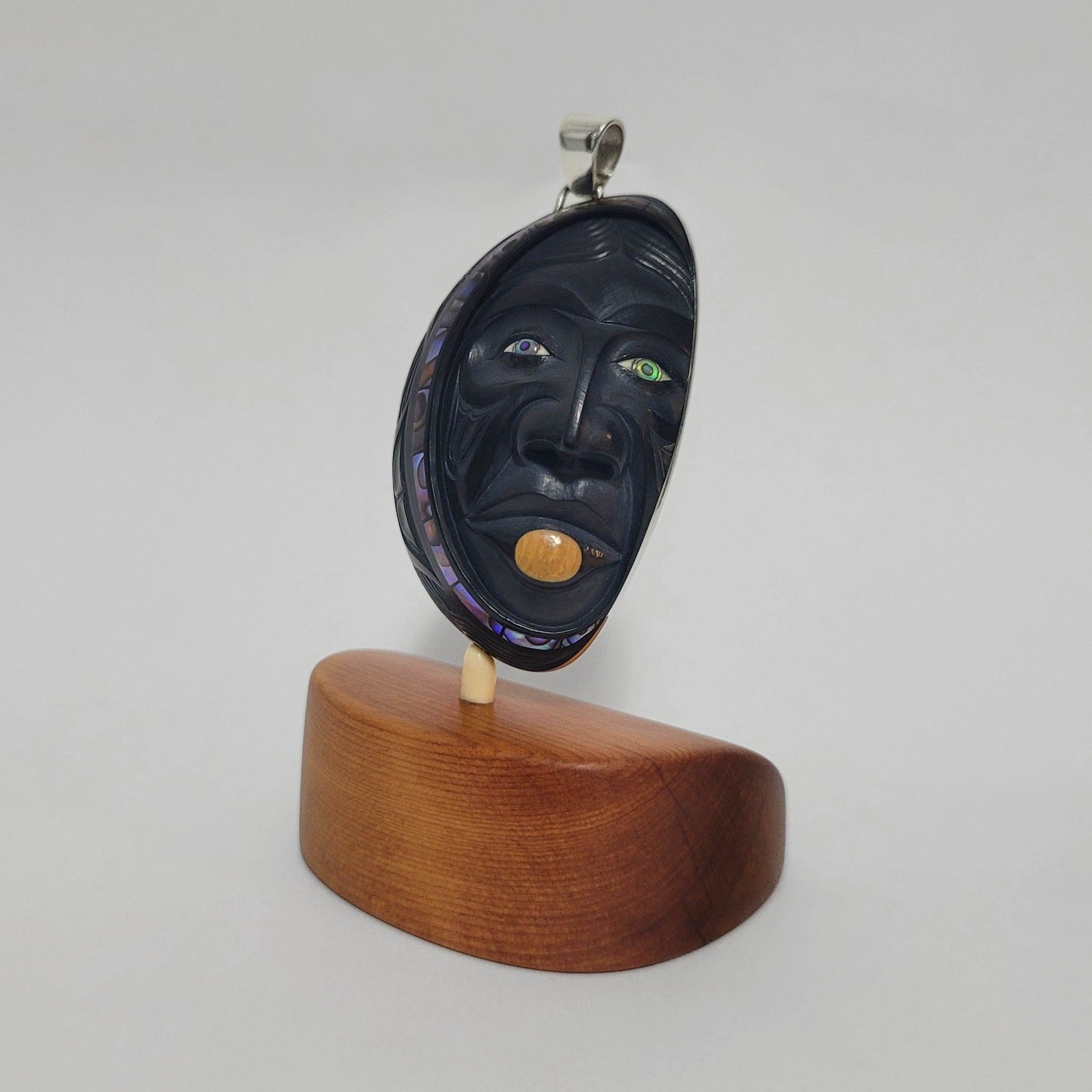 Woman in the Moon argillite pendant by Haida artist Darrell White