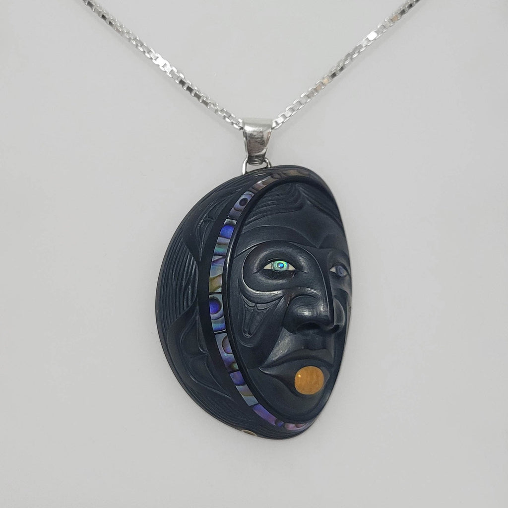 Woman in the Moon argillite pendant by Haida artist Darrell White