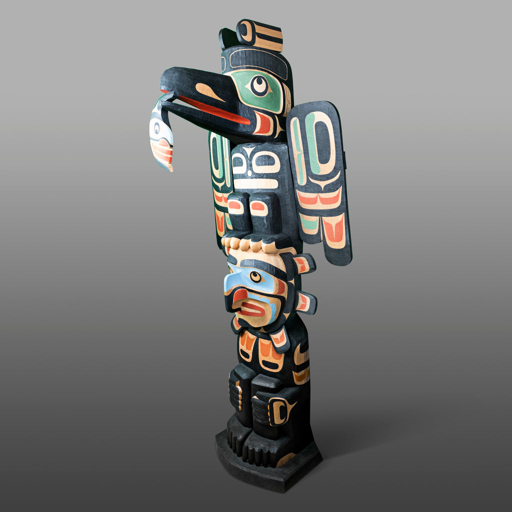 Raven and Sun Totem Pole by Kwagul Master Carver Calvin Hunt
