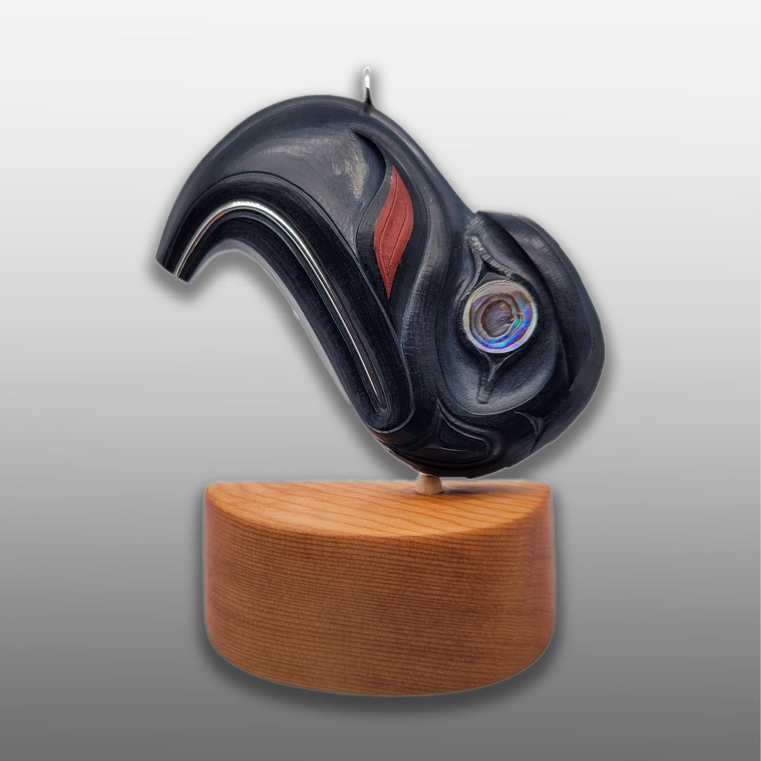 Argillite Eagle Pendant on Yew wood stand by Haida artist Darrell White