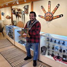 Kwakwaka'wakw carver Gilbert Dawson holding Native Bear Mask