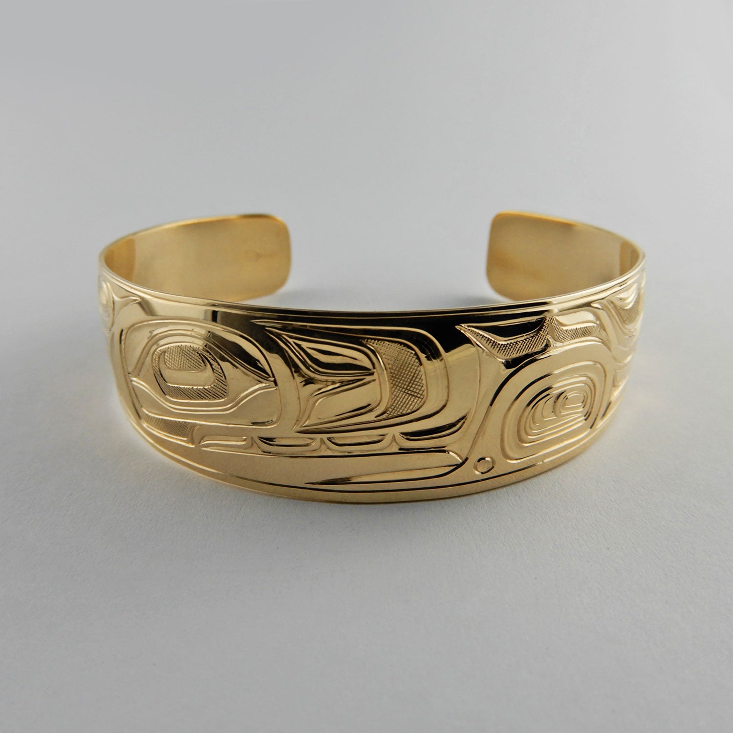 Gold First Nations Orca Bracelet by Kwakwaka'wakw artist Joe Wilson