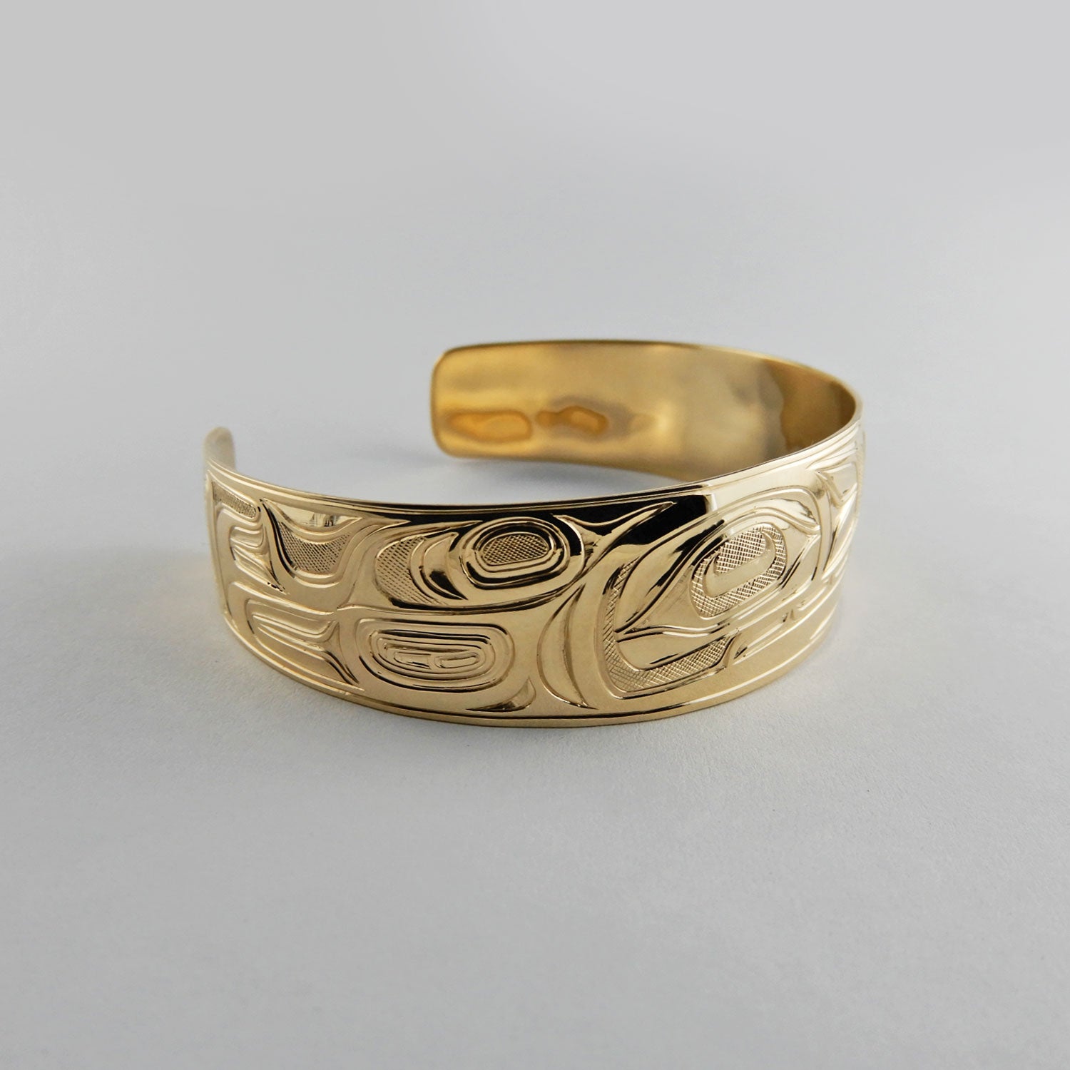 Gold First Nations Orca Bracelet by Kwakwaka'wakw artist Joe Wilson