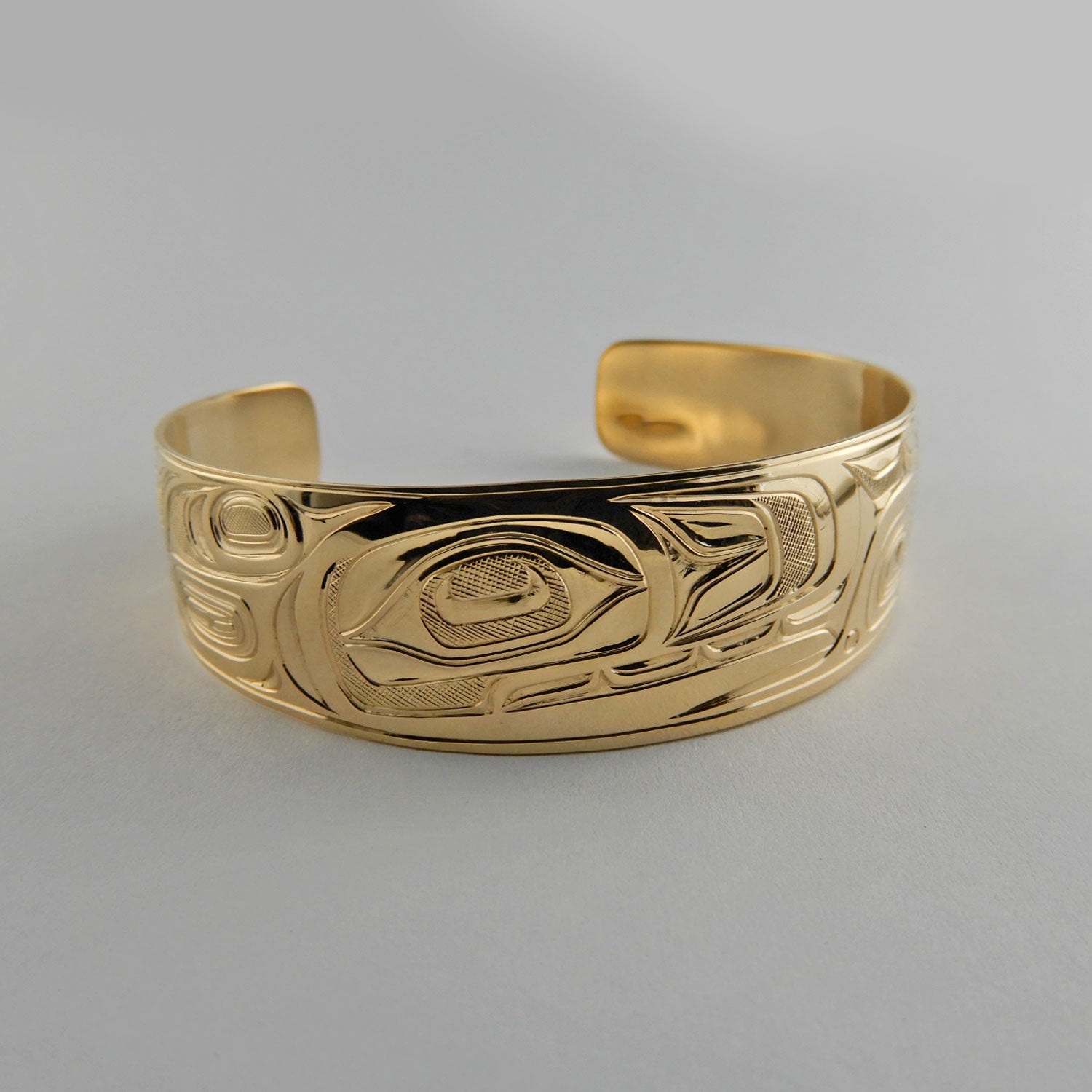 Gold First Nations Orca Bracelet by Kwakwaka'wakw artist Joe Wilson