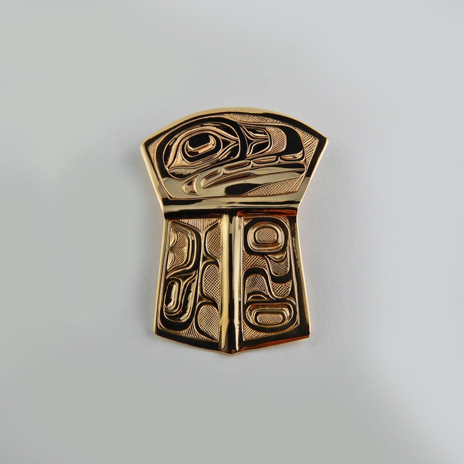 Gold Copper-shaped Orca Pendant by Kwakwaka'wakw artist Joe Wilson