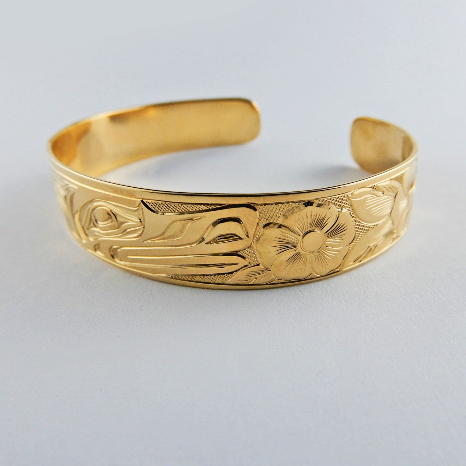 Gold First Nation Wolf Bracelet by Kwakwaka'wakw artist Joe Wilson