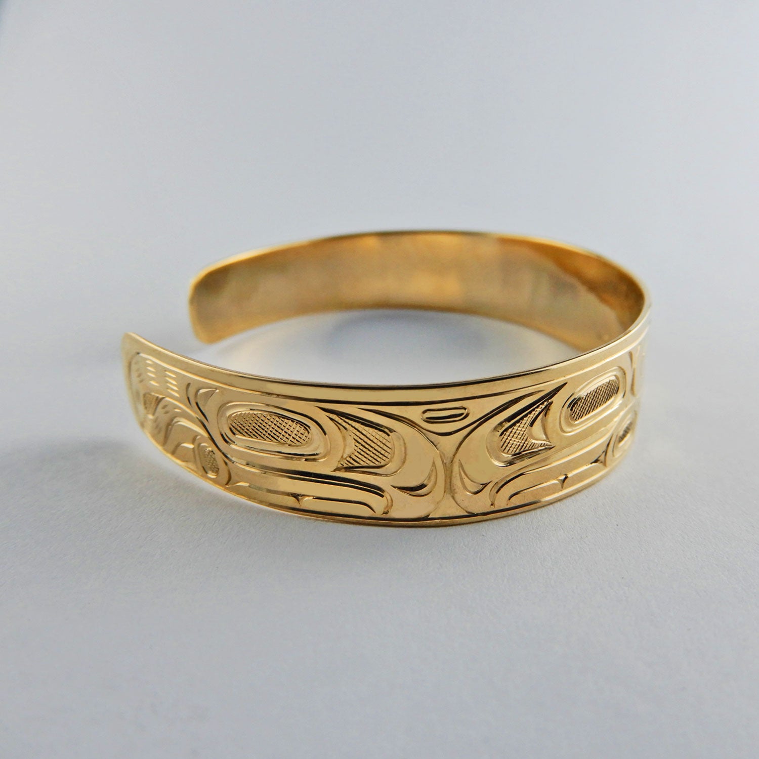 Gold First Nation Wolf Bracelet by Kwakwaka'wakw artist Joe Wilson