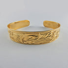 Gold First Nation Wolf Bracelet by Kwakwaka'wakw artist Joe Wilson