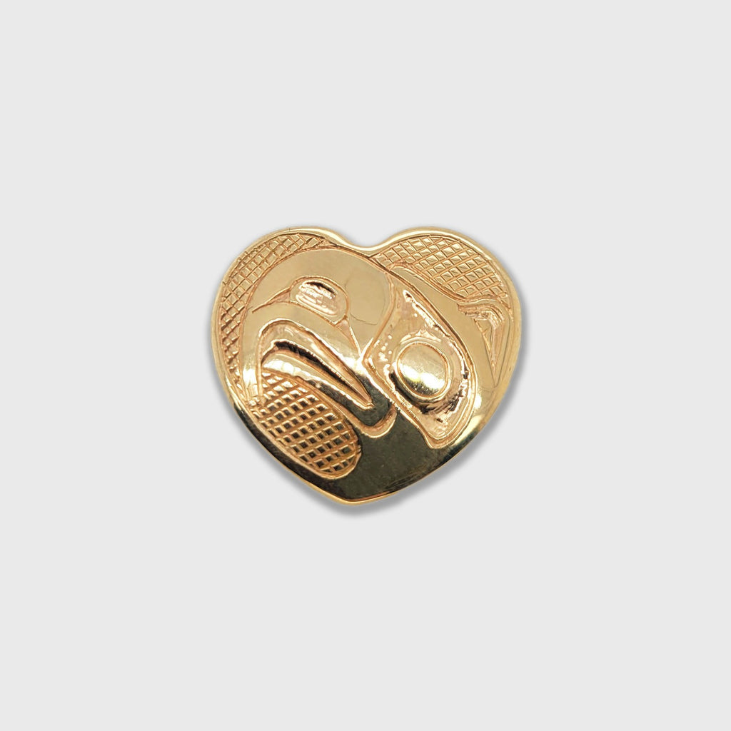 Gold Heart-shaped Eagle pendant by Haida artist Carmen Goertzen