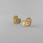 Gold Heart-shaped Eagle stud earrings by Kwakwaka'wakw artist Joe Wilson