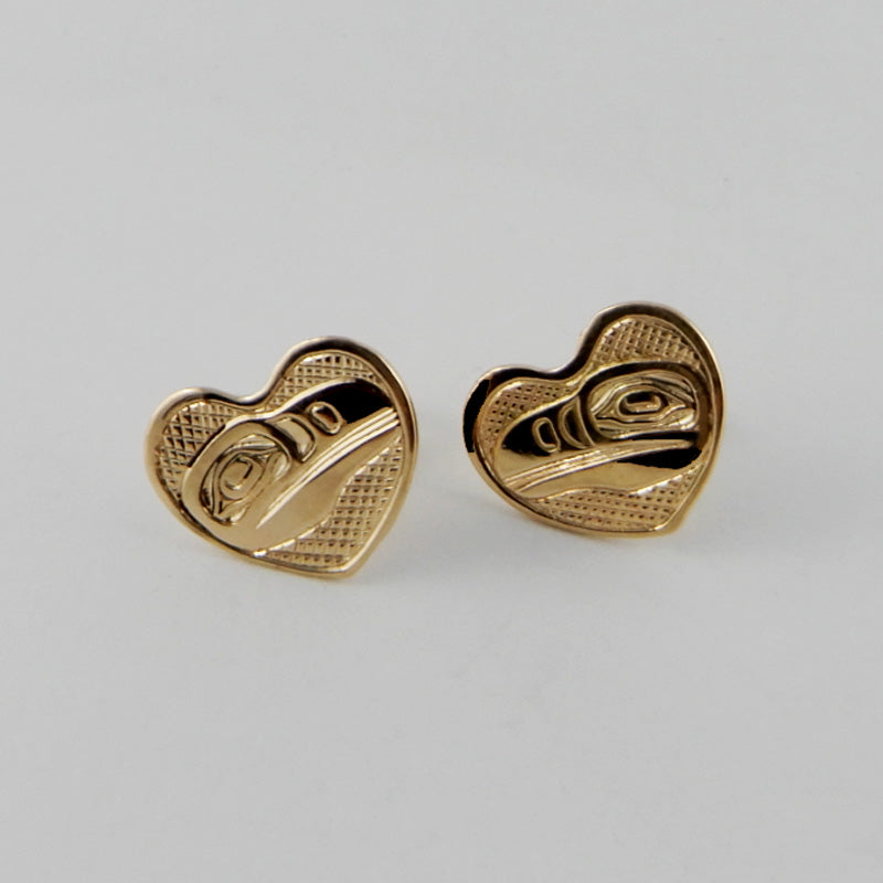 Gold Heart-shaped Raven stud earrings by Kwakwaka'wakw artist Joe Wilson