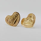 Gold Heart-shaped Wolf stud earrings by Kwakwaka'wakw artist Joe Wilson