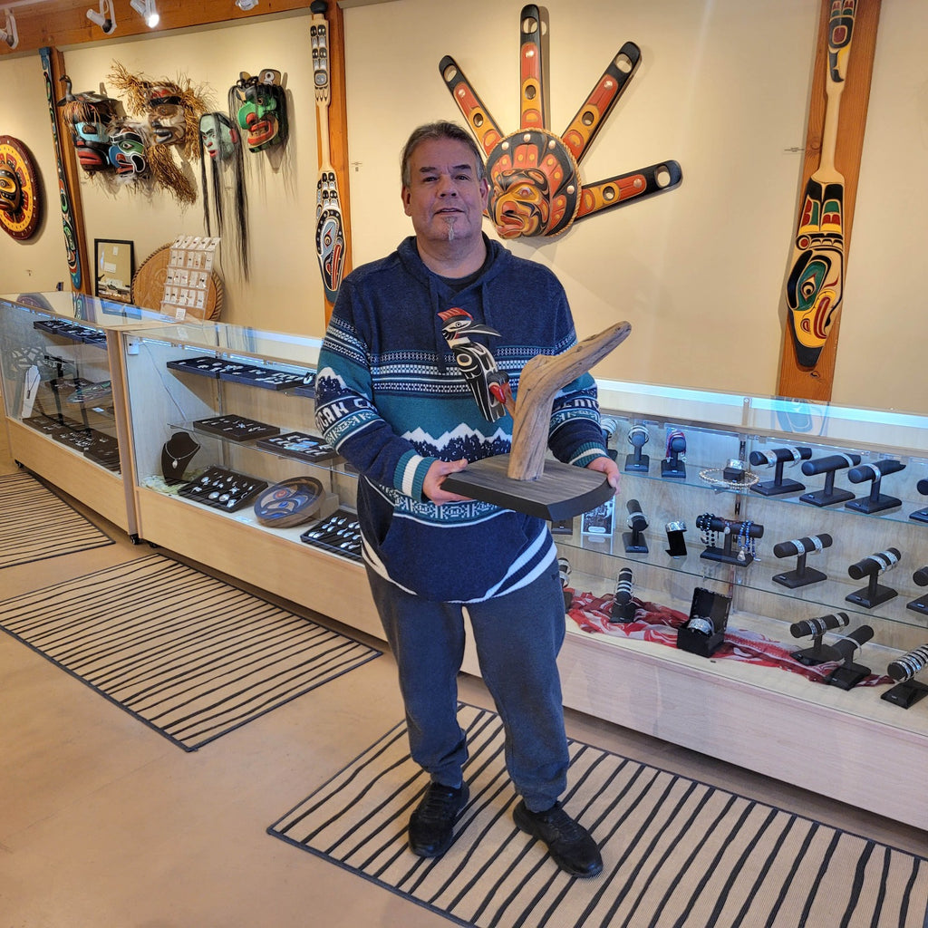 Kwakwaka'wakw carver Greg Henderson with First Nations Woodpecker Rattle and stand