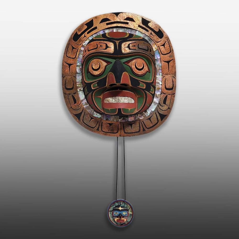 Large and small Moon Masks by Kwakwaka'wakw carver Kevin Cranmer comparison