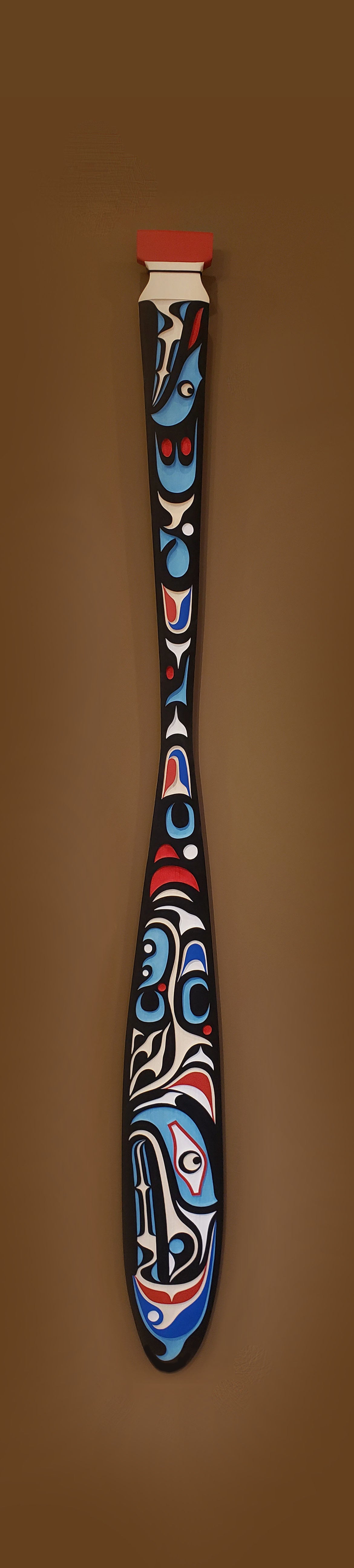 Sandblasted Cedar Sea Wolf Paddle by Kwakiutl artist Trevor Hunt