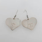 Silver Heart-shaped Eagle Earrings by Kwakwaka'wakw artist Chris Cook