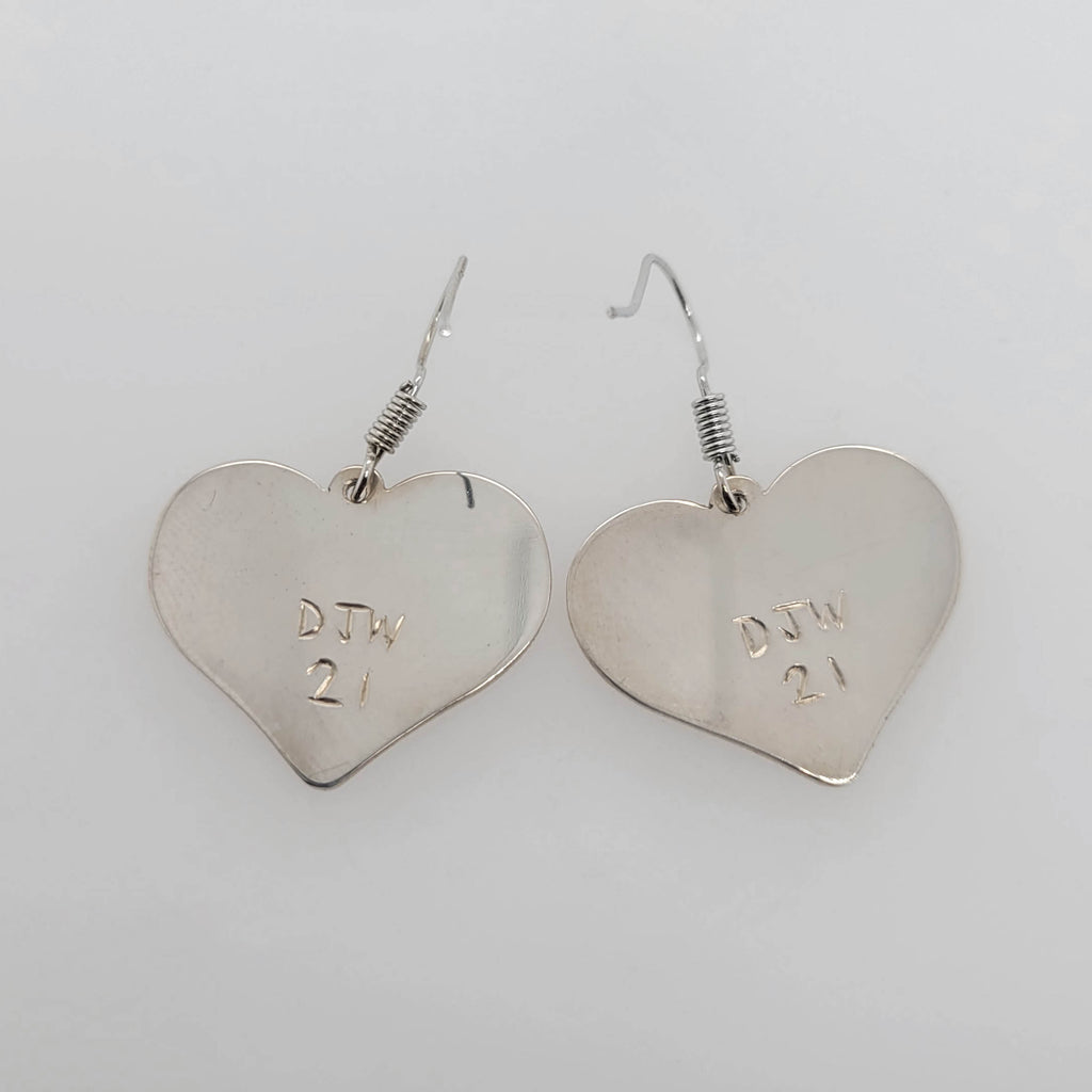 Silver Heart-shaped Eagle Earrings by Kwakwaka'wakw artist Chris Cook
