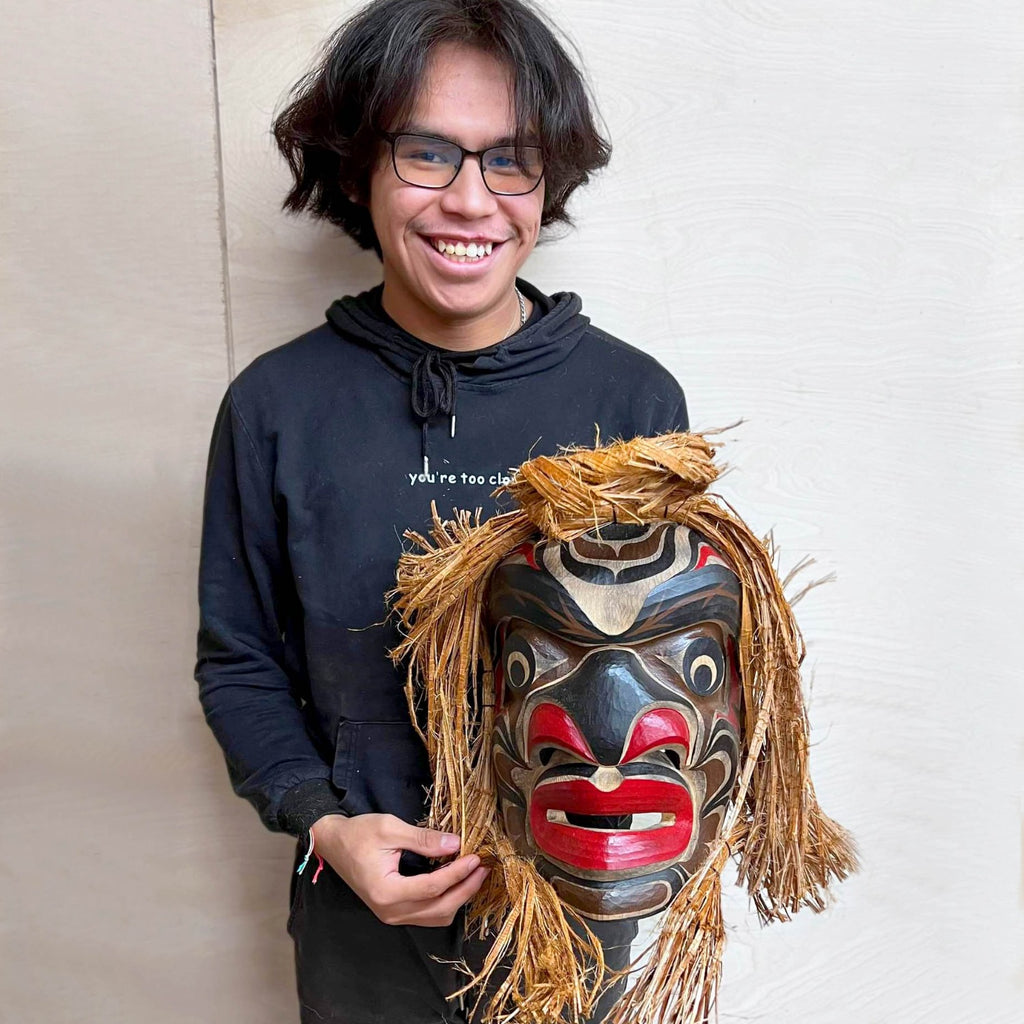 Kwakwaka'wakw carver Talon George holding Warrior Mask