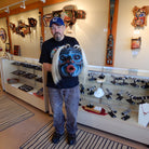 Kwakwaka'wakw carver Tom Hunt holding Whale Hunter Mask