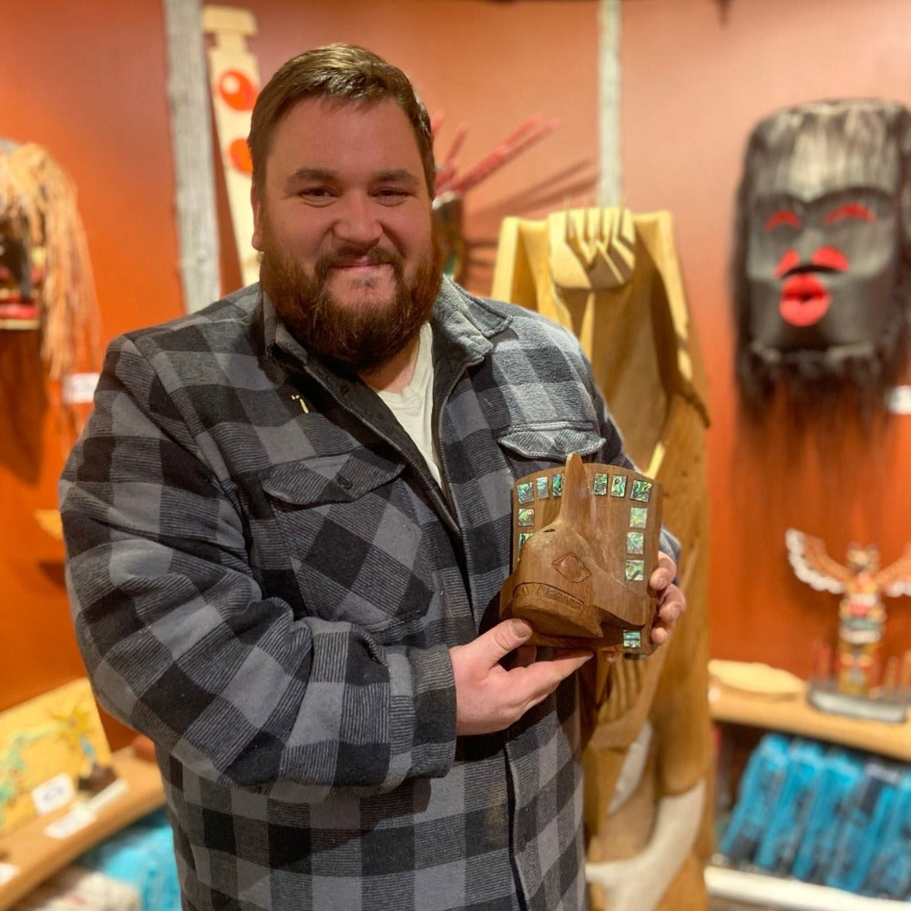 Nuu-chah-nulth carver Hjalmer Wenstob holding Red Cedar and Abalone Orca Frontlet