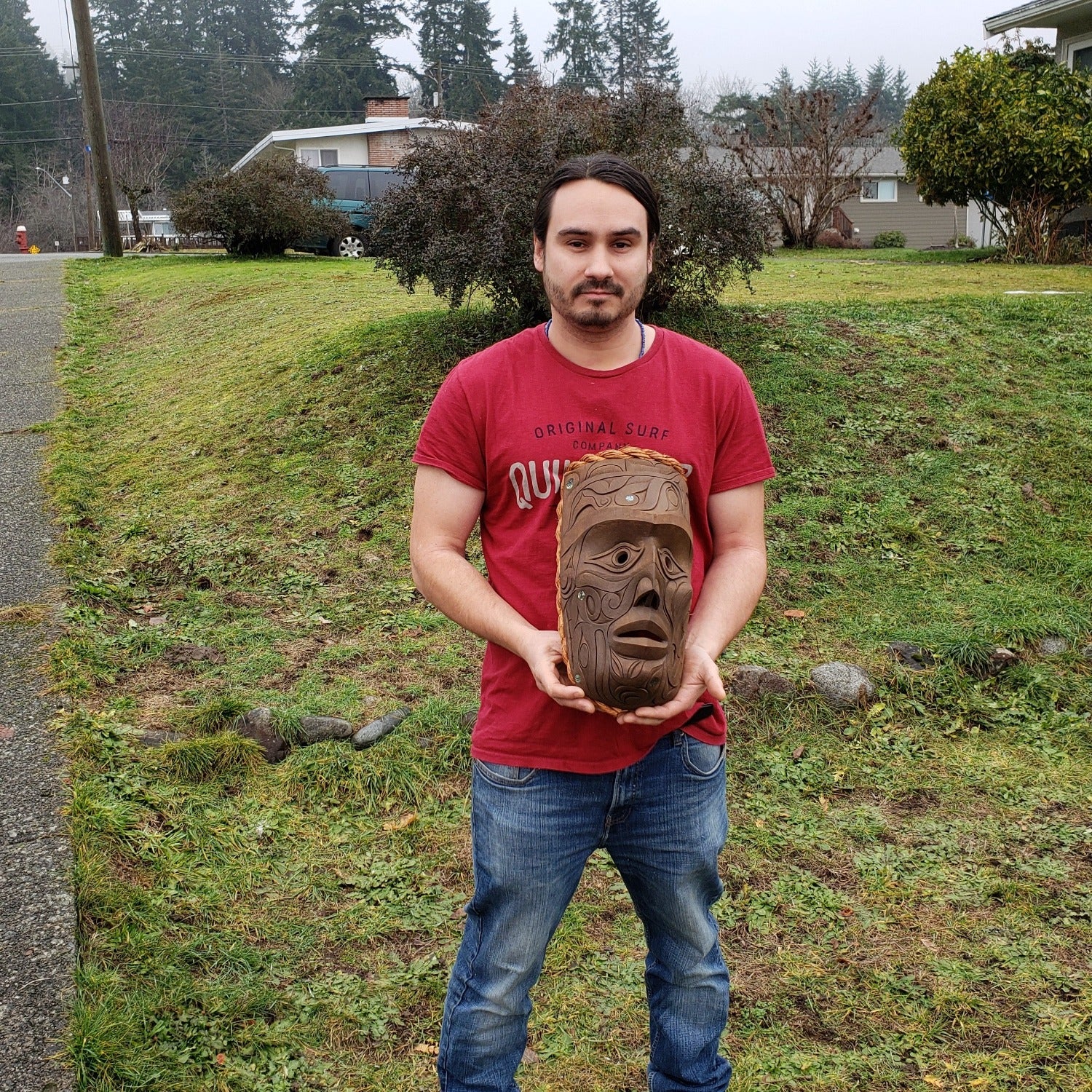 Nuu-chah-nulth carver Joshua Prescott holding Thunderbird Mask